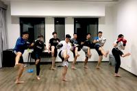 Participants practising Thai Boxing kicks